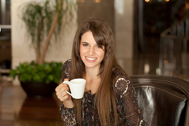 Young woman drinking coffee stock photo
