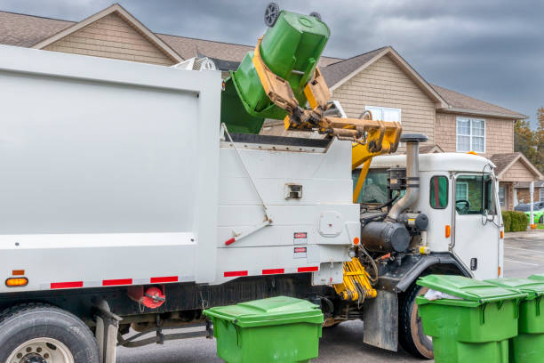 istock Mechanical Arm On Modern Trash Truck Dumps Garbage Without Help 1470305583