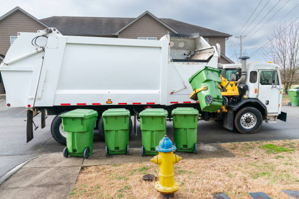 istock Automated Garbage Truck Picking Up Trash Container on Curb 1470305714