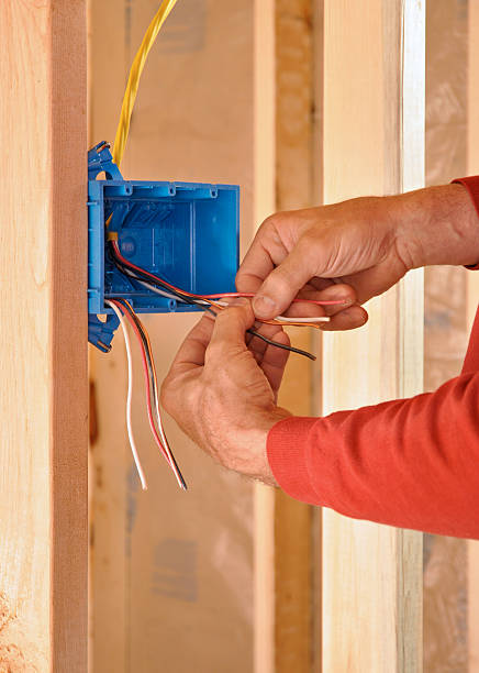 istock Electrician's hands connecting wires 147030813