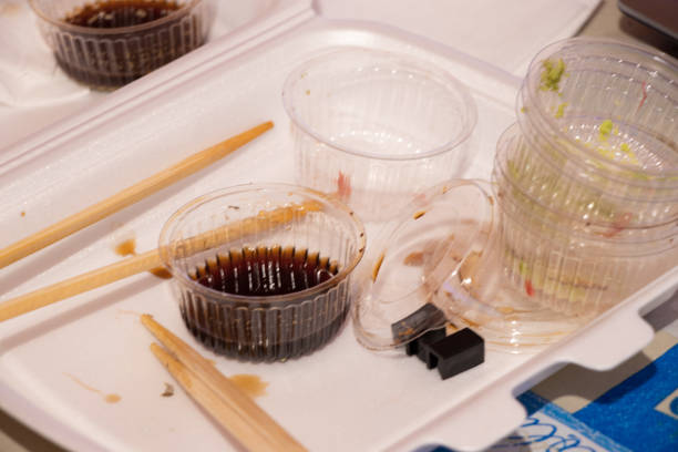 set with sushi from the store in plastic packaging on the table for dinner, there is sushi at the table at home, plastic disposable sushi packaging