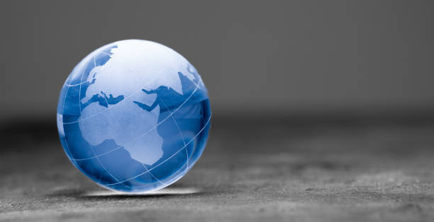 istock Blue world globe crystal glass on black background 1470312071