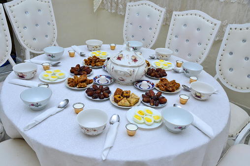 Moroccan Algerian breakfast table. Vintage background with different plates with delicious traditional middle eastern food