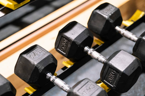 istock Dumbbells arranged in order on the stand for dumbbells. 1470314905