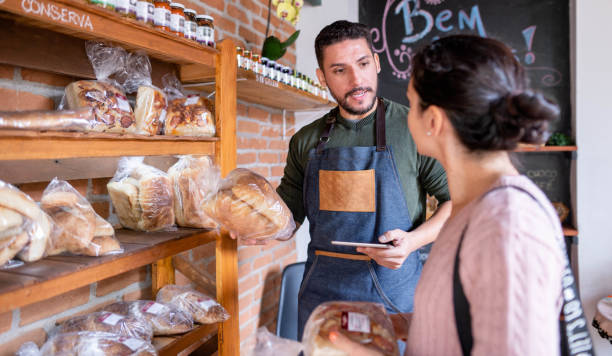 istock Customer being attended by a server after in a bakery purchase 1470319229