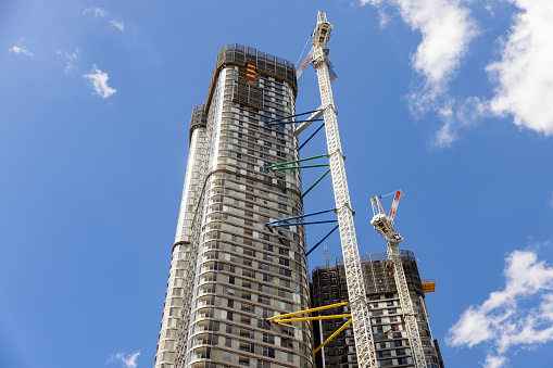 Construction of skyscraper in the city, low angle view, background with copy space, full frame horizontal composition, Sydney Australia