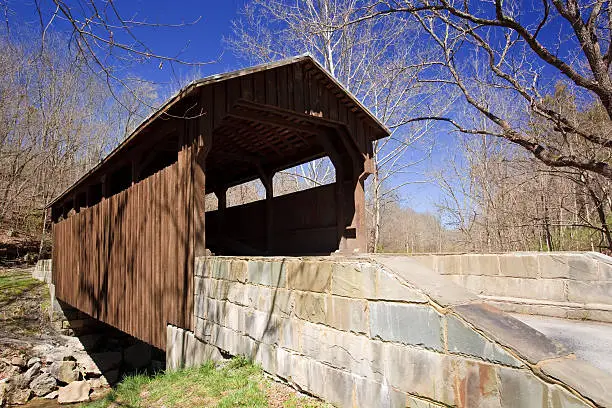This historic covered bridge (c. 1884) provided access to the S.S. Herns mill and is one of only two covered bridges remaining in Greenbrier County, West Virginia.  The bridge is 54 feet long and spans Milligans Creek about four miles from downtown Lewisburg.