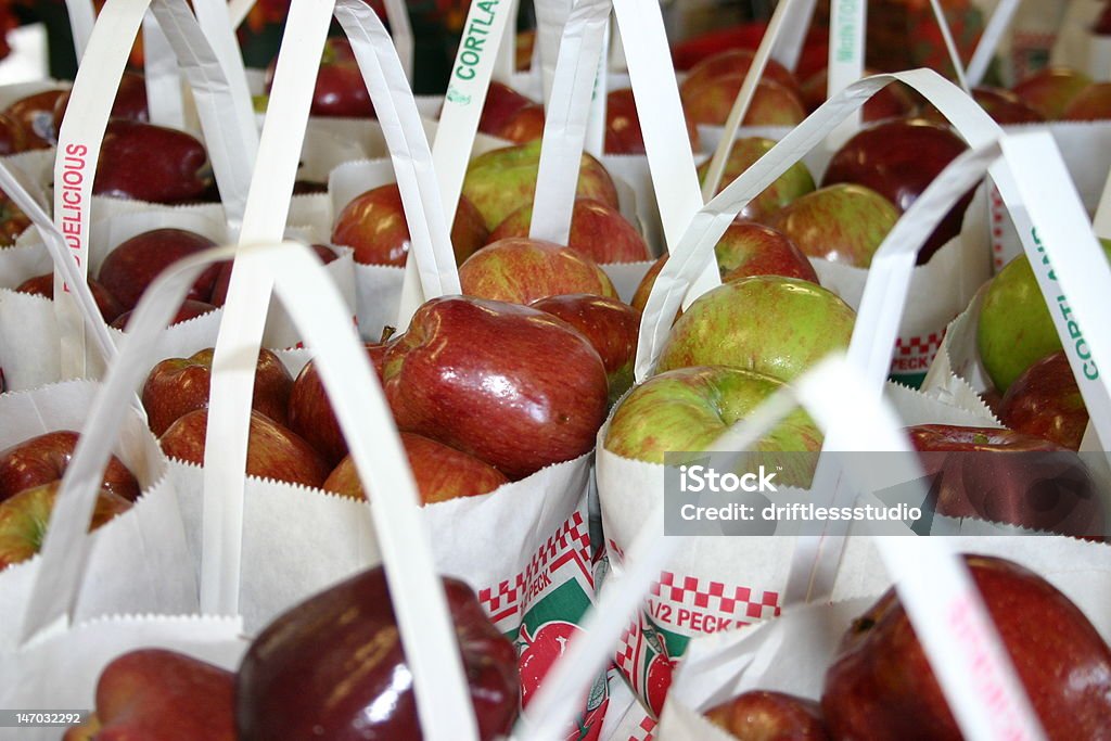 Apple harvest at farm market Bags of organic apples stand ready for purchase at a farm market. Agricultural Fair Stock Photo