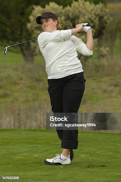 College Golfer Swing An Iron Golf Club Stock Photo - Download Image Now - Activity, Adult, Challenge