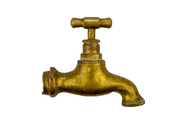 Old copper faucet isolated on a white background.