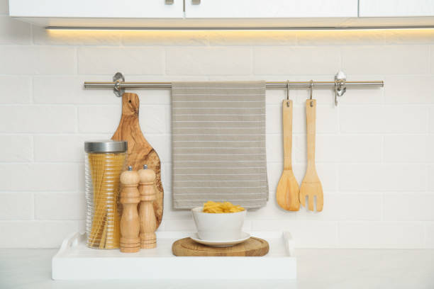 istock Clean towel, utensils and uncooked pasta in kitchen 1470326859