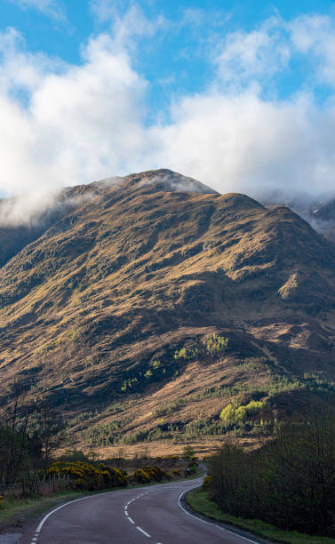istock Misty morning on a Scottish road 1470327075