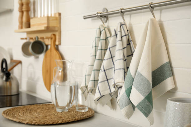 istock Different clean towels hanging on rack in kitchen 1470327243