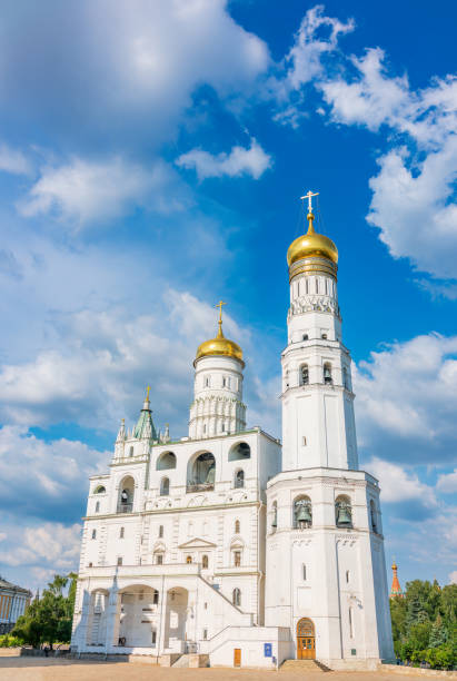 istock Ivan the Great Bell Tower, with Assumption Belfry on the right in Moscow Kremlin. Blue sky background with sunbeams 1470329675