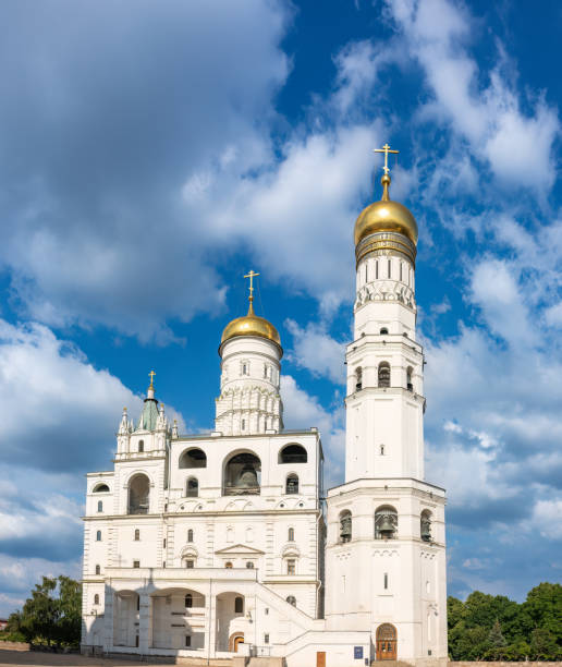 istock Ivan the Great Bell Tower, with Assumption Belfry on the right in Moscow Kremlin. Blue sky background with sunbeams 1470329677