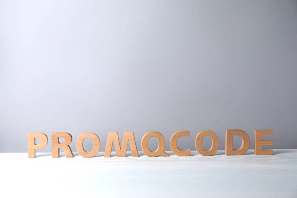 istock Words Promo Code made of wooden letters on white table, space for text 1470331137