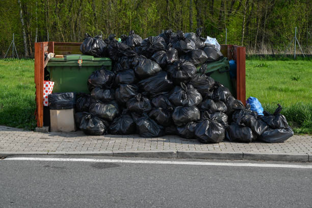 Overflowing rubbish containers and garbage bags Shot on overflowing rubbish containers and heap garbage bags on a public parking overflowing dumpster stock pictures, royalty-free photos & images