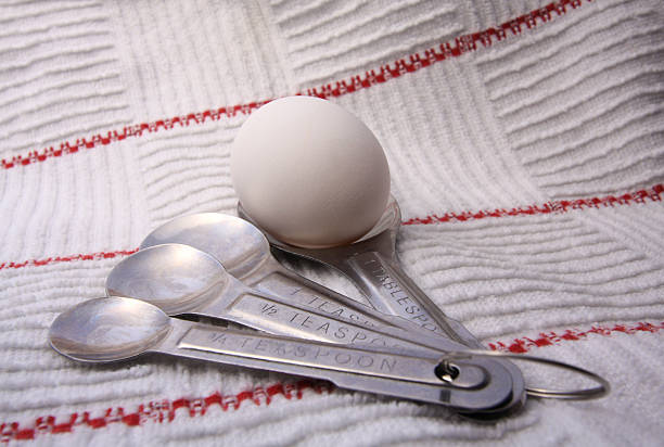 Egg and spoons stock photo