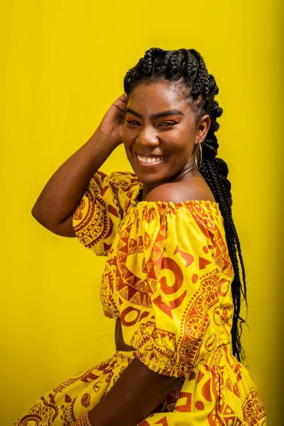 istock Beautiful young woman sitting on a stool. Colorful clothes. 1470334861