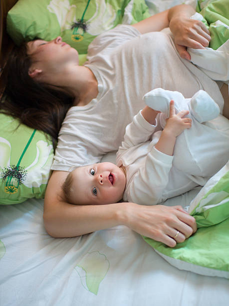 Baby with mom stock photo