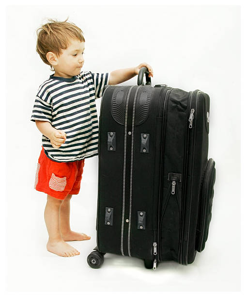istock young tourist with heavy suitcase 147034597