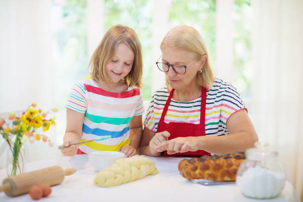 istock Mom and child baking bread. 1470345993