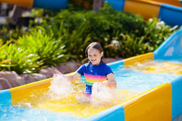 istock Kids on water slide in aqua park. Summer vacation 1470346082