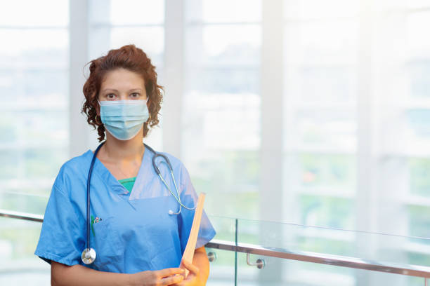 istock Doctor or nurse with stethoscope and face mask. 1470346137