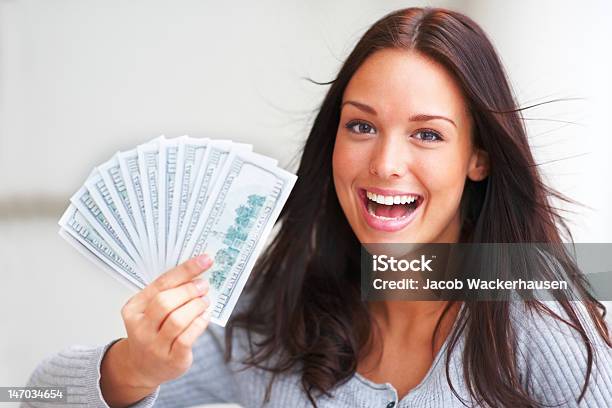 Closeup Of Young Woman Holding Paper Currency Stock Photo - Download Image Now - 20-24 Years, 20-29 Years, Achievement