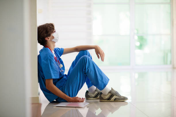 istock Exhausted tired doctor. Health workers shortage. 1470346738