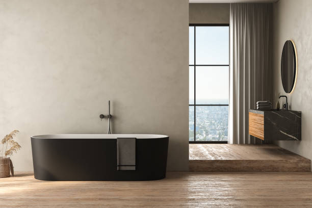istock Modern bathroom interior with beige wall and travertine floor, black bathtub, marble basin, front view. Minimalist bathroom with modern furniture and city view. 3D rendering 1470349268