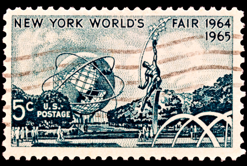 The New Yorks Worlds Fair 1964-1965 was issued in 1964. The image of the unisphere is still standing in Flushing Meadow Park and has been seen in many movies most famously in Men in Black. Also shown is 