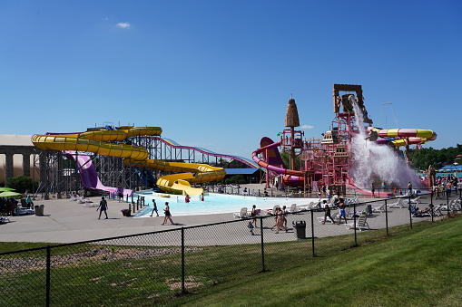 Wisconsin Dells, Wisconsin USA August 11th, 2019: Family members enjoy summer fun at LOST CITY OF ATLANTIS water rides at Mt. Olympus Water and Theme Park.