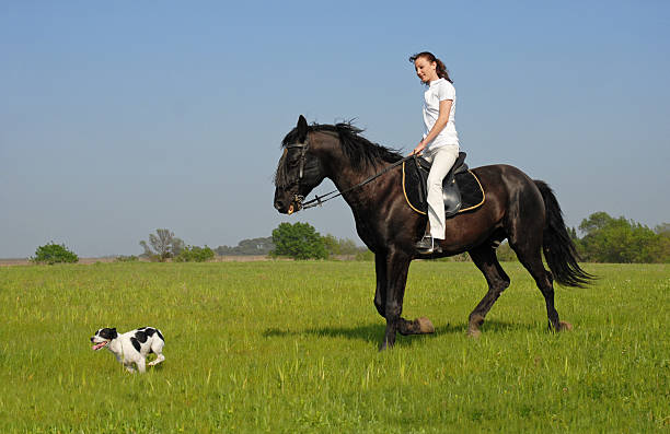 istock riding girl and her dog 147035046