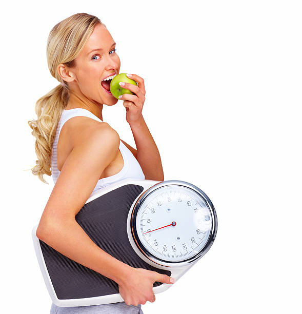 https://media.istockphoto.com/id/147035177/photo/beautiful-young-woman-holding-measuring-instrument-and-eating-an-apple.jpg?s=612x612&w=0&k=20&c=NnPo5mNquBU2dpWqkDKkFCTy0103GpkEiWbewLkjwR0=