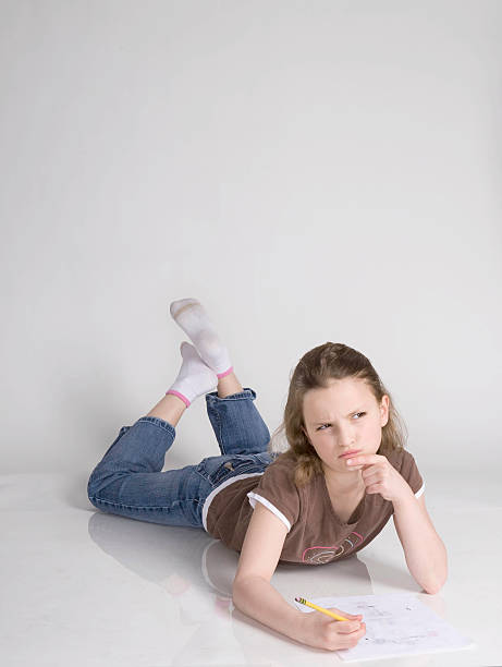 istock Young Girl Writes her homework 147035255