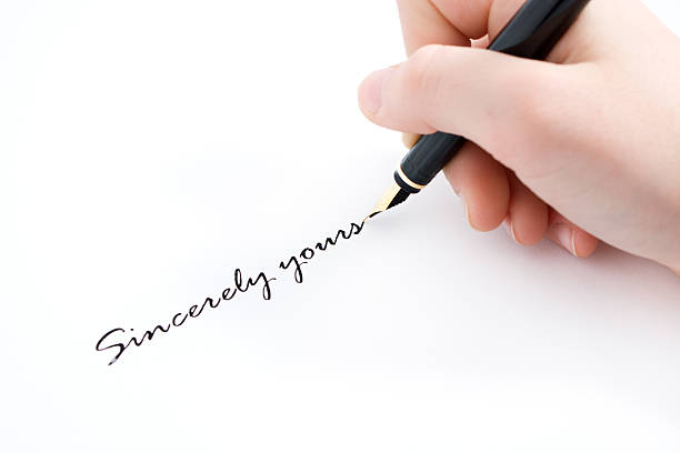 istock hand and fountain pen writting sincerely yours text 147035379