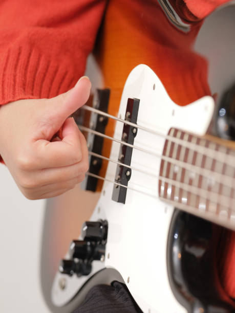 istock play guitar music rock woman 1470354414