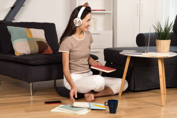 istock Woman studying online from her living room 1470355938