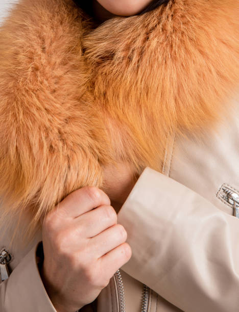 istock Woman holding her fur with her hands. Close-up. 1470357002