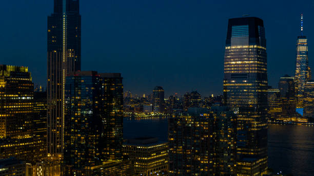 istock Modern skyscraper in Paulus Hook, Jersey City with the Hudson River and distant Manhattan view. 1470358234