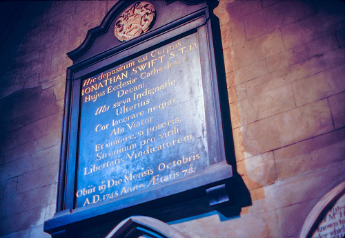 Dublin, Ireland - July 16, 1986: 1980s old Positive Film scanned, Latin inscription concerning Jonathan Swift in St Patrick's Cathedral, Dublin, Ireland.
