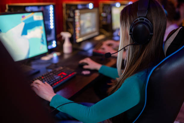 istock Young woman playing video game 1470358474