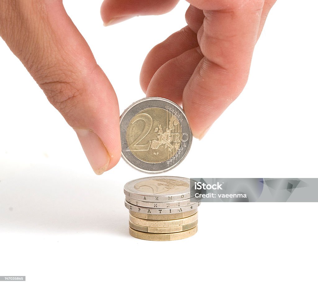 Mano con Moneta da due euro - Foto stock royalty-free di Arto - Parte del corpo