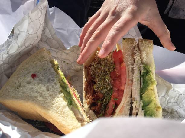 istock Hand me the sandwich 1470359276