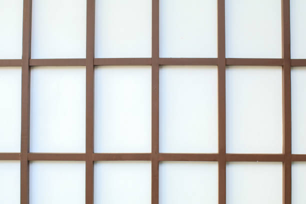 istock Wall of white wood grid panels. Wall decorative interior background. Gorgeous texture and wallpaper of squares. Japanese style. 1470359478