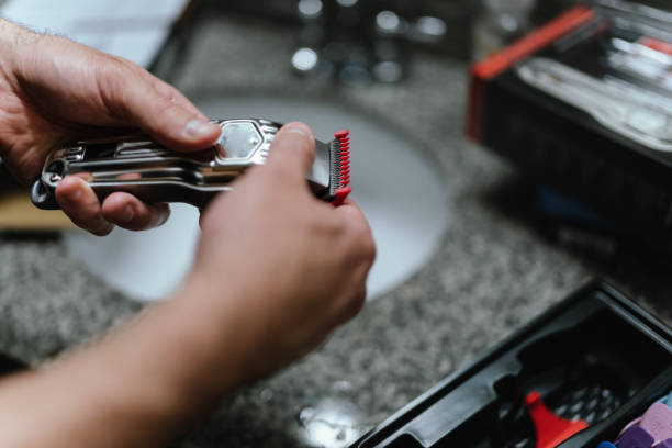 istock Man holding electric razor in bathroom 1470359499