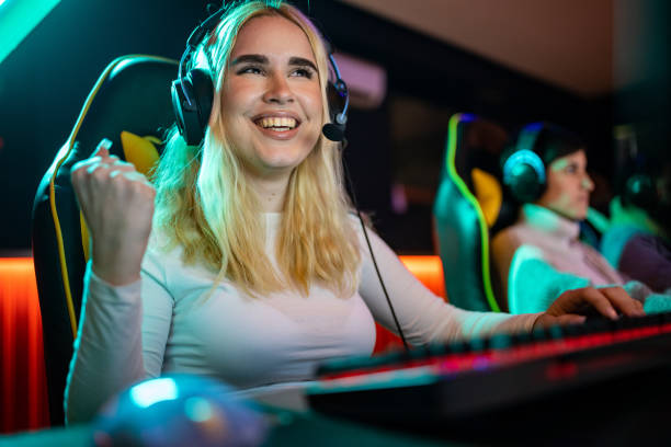istock Woman playing video game 1470359686