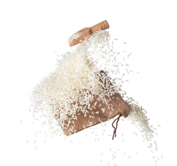 istock Japanese Rice in sack bag flying explosion, white grain rices fall abstract fly. Beautiful complete seed rice bag splash in air, food object design. White background isolated, high speed freeze motion 1470359783