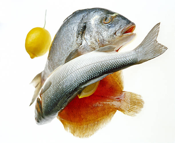 three fish and lemon stock photo